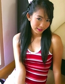Dolla has the skills that will keep your attention. She models a red top and she enjoys smiling for the camera.