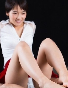 Beauty in red Ai Mukai fingers herself before using her feet to get her slave off