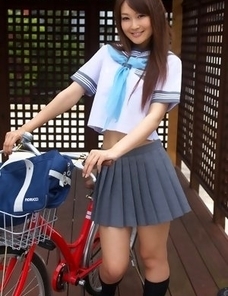 Misaki Nito in school uniform goes to classes riding bike