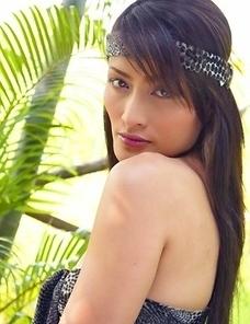 Don't miss the sexy Bella Yong as she models in the forest and sports a leopard print headband. She licks her finger and begins taking off her cl