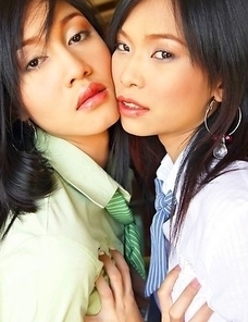 Ae and Yoko come together for a very important business meeting. They catch each other's eyes and they smile at one another.