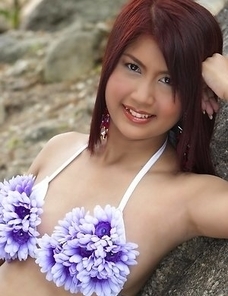 Check out this amazing video where stunning April Lim is wearing a cute purple flower bikini suit.