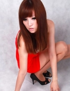 Sandy on heels shows hot behind in red dress for pictures