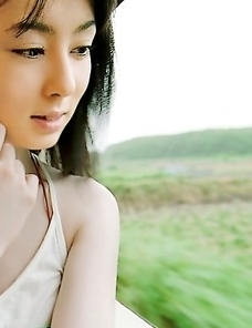 Rina Akiyama with sexy lips rubs her cunt of bar outdoor