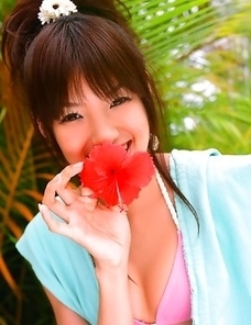 Akina Minami in colorful bath suits plays with big ball