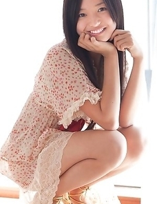 Mayumi Yamanaka smiles while undressing with erotic moves