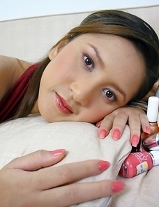 View Lisa Linn as she lies on the sofa and talks to a friend. Apparently, these two are a little more than friends as she begins rubbing on her hot bo