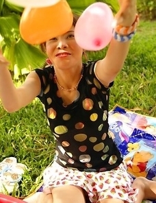 Nadear Beeker got a lot of colorful balloons and she put them all on the grass