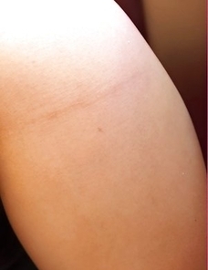 Let Bulma Karder take you into her erotic world as she sits on a sofa and places her finger inside of her mouth.