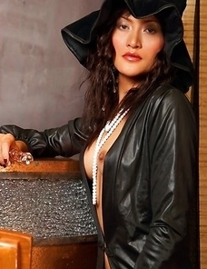 Bella Yong has on a sexy witch's costume with her blouse open. Her nipples are hard as her pearls split her chest.