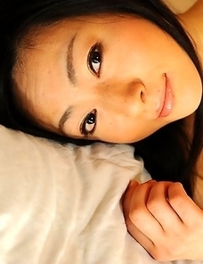 Lustful Emiko Koike teases on bed