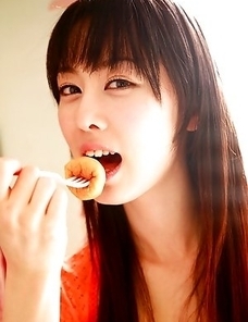 Rina Akiyama Asian in long colorful socks enjoys some sweets