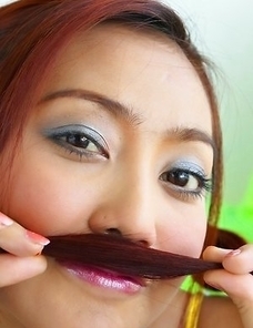 Iko Yeung loves the spotlight as she gets into her routine. She spreads her pussy lips open with her hands as she lies on the bed.