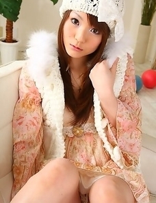 Hot babe Fuwari poses on the couch