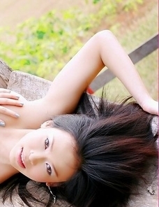 Lovely Ae Marikarn is posing next to the stables. She looks so pretty that your heart will skip a beat when you see her.